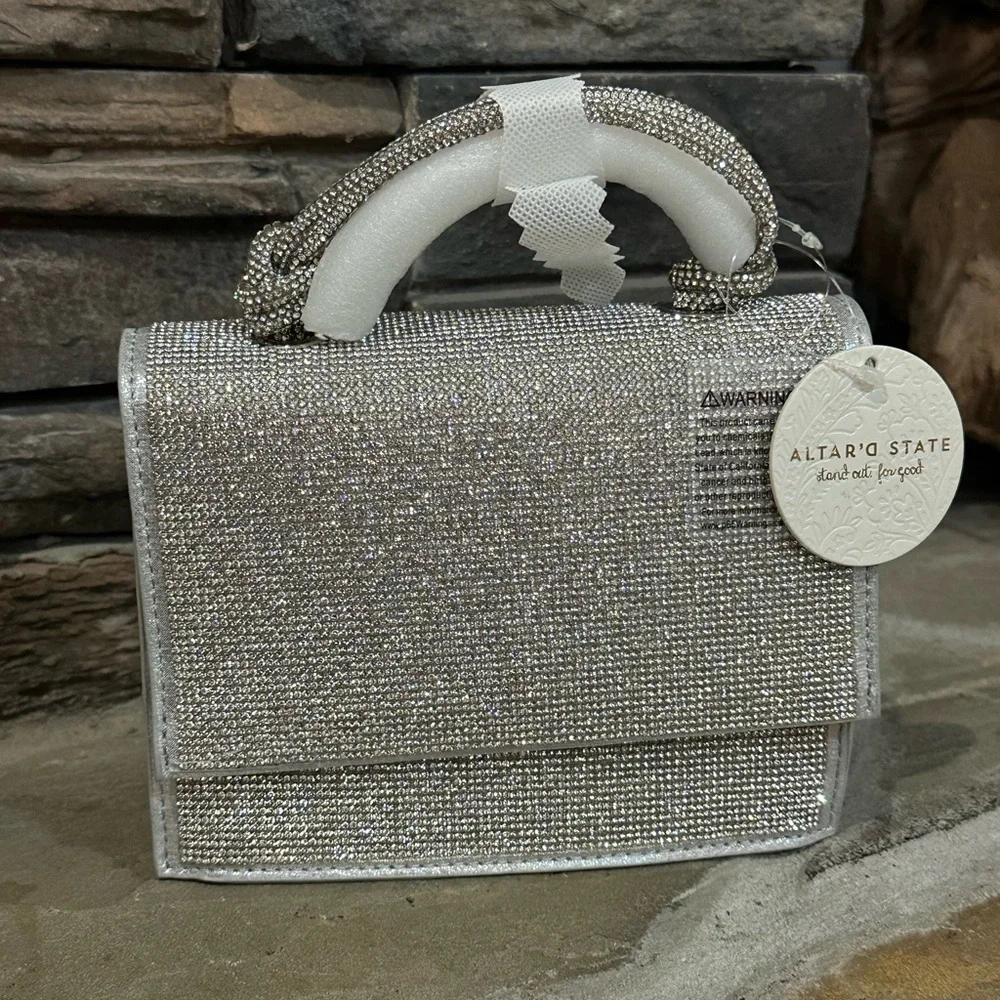 NWT Urban Expressions Silver Clutch/Purse with handle and matching chain straps.